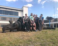 Scrapheap challenge accepted - students sculpt giant armadillo from repurposed tyres
