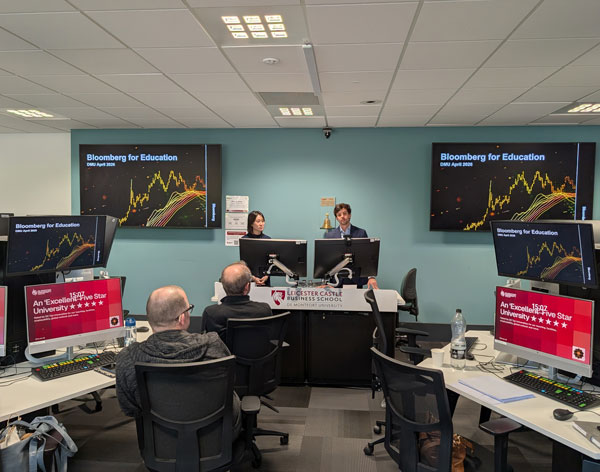 Gon&ccedil;alo Santos and Kisumi Kan from Bloomberg for Education presenting on the DMU Trading Floor