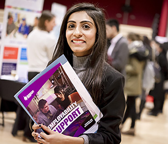 female-at-a-conference-with-a-brochure