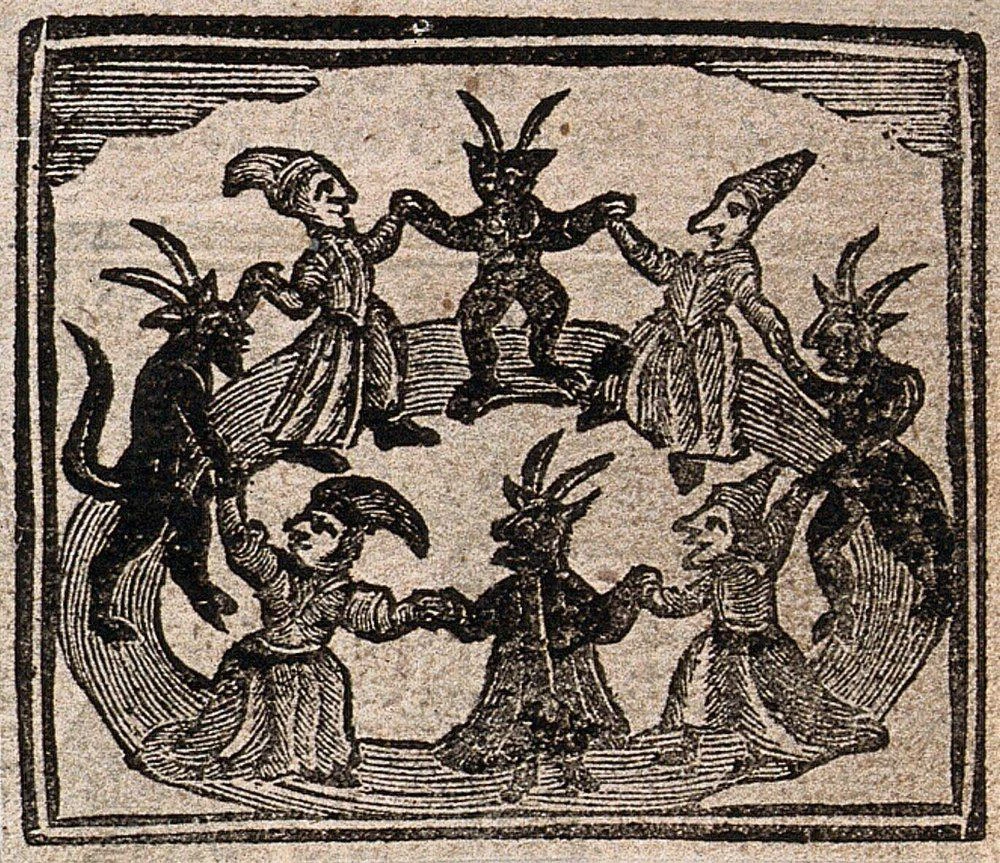 Seven figures with animal or devil-like features holding hands in a circle, appearing to dance.