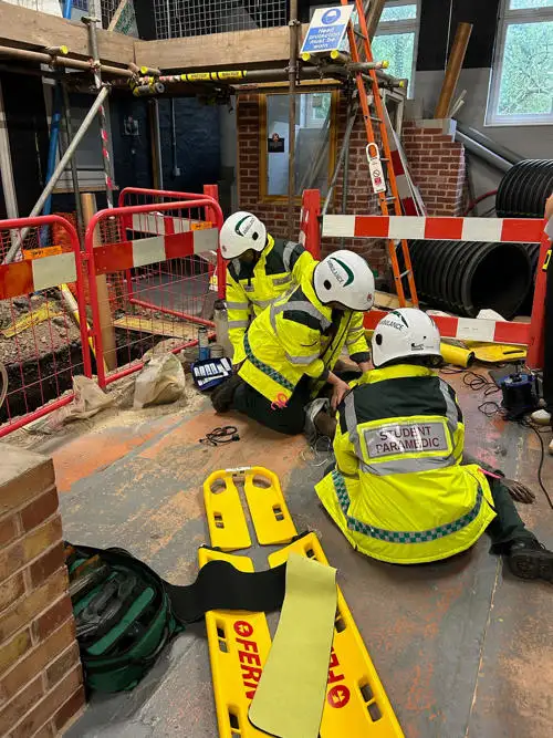 Students working in a simulated construction site (off campus)