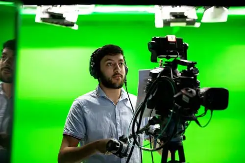 Student operating a TV studio camera
