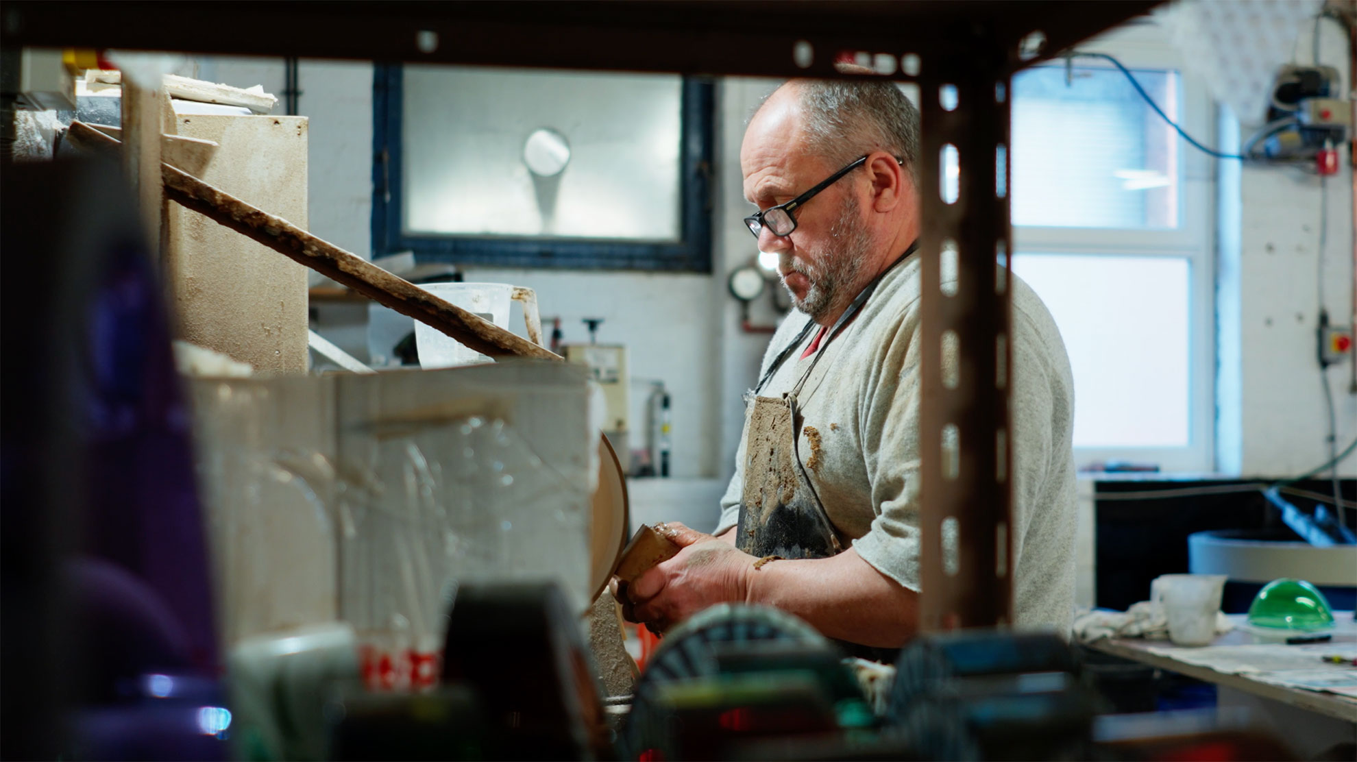 Video still of a man doing metalwork