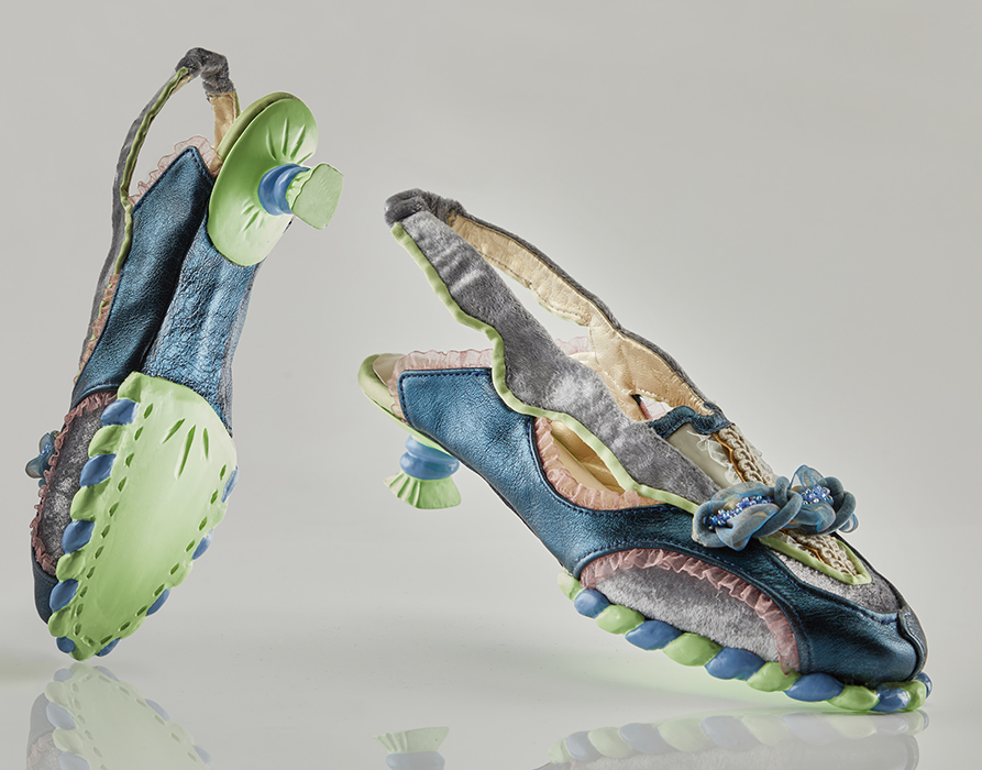 Shoes made with a variety of fabrics and textures in greens, blues and greys