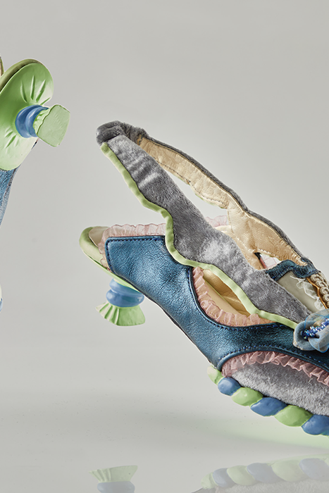 Shoes made with a variety of fabrics and textures in greens, blues and greys