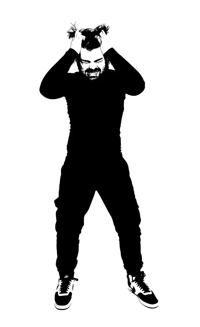 Rox Rixon: Black and white high contrast image of a man with his hands in his hair