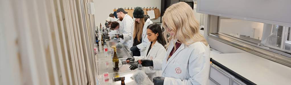 Professional policing students in a lab on a DMU global trip