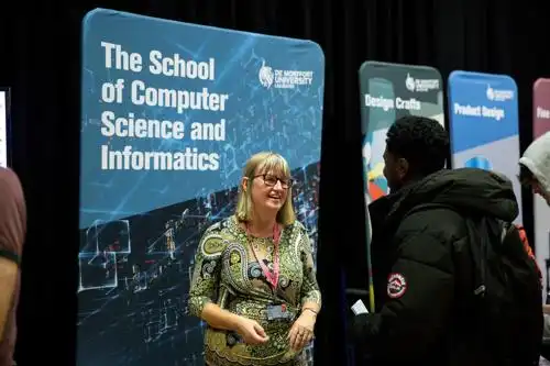 Academics and students talking to visitors