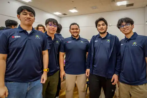 Group of students in DMU x APU tshirts