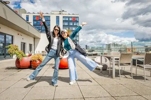 Two students on the Vijay Patel top floor balcony