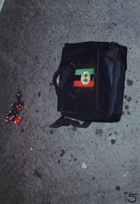 Police photograph of Stephen’s bag where he dropped it in the road.