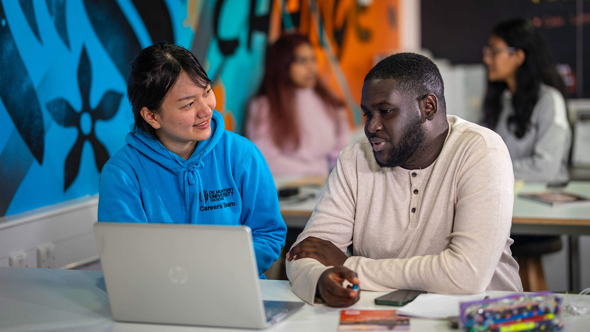 A student talking to a member of the Careers Team